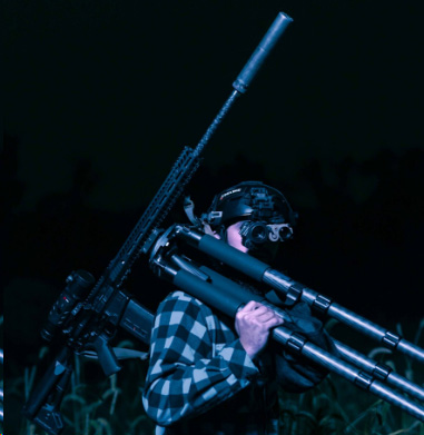 Man wearing a helmet at night. 